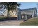 Gray two-story house with stone accents, two-car garage, and landscaping at 1128 Palo Vista Rd, Greenwood, IN 46143