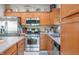 Well-equipped kitchen boasting stainless steel appliances and warm wood cabinets at 1167 Old Vines Ct, Greenwood, IN 46143