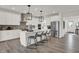 Modern kitchen featuring white cabinets, a center island, and stainless steel appliances at 11907 Aubrey Ln, Fishers, IN 46040