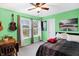 Bedroom with green walls, a bed, and a desk at 15483 Gallow Ln, Noblesville, IN 46060