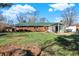 Large backyard with green grass and a sunroom at 1645 Leerkamp Dr, Franklin, IN 46131