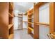 Walk-in closet with ample shelving and hanging space at 1832 Lakeside Ln, Indianapolis, IN 46229