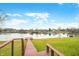 Steps leading down to a wooden dock by the lake at 1832 Lakeside Ln, Indianapolis, IN 46229