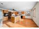 Kitchen features island, wood cabinets, and breakfast nook at 1832 Lakeside Ln, Indianapolis, IN 46229