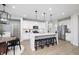 Modern kitchen with island, stainless steel appliances, and white cabinets at 19063 Seaforth Way, Westfield, IN 46074