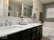 Spacious bathroom with double sinks, marble countertop, and a relaxing bathtub at 2181 Russet Ct, Plainfield, IN 46168