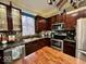 Kitchen with stainless steel appliances and an island with butcher block top at 2181 Russet Ct, Plainfield, IN 46168