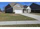 Two-story house with a white garage door and long driveway at 2374 Riviera Pl, Greenwood, IN 46143