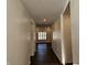 Bright hallway with dark hardwood floors at 2374 Riviera Pl, Greenwood, IN 46143