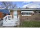 Front view of brick ranch home with white steps and awning at 33 S Post Rd, Indianapolis, IN 46219