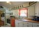 White kitchen with wood countertops and orange accents at 33 S Post Rd, Indianapolis, IN 46219