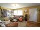 Living room with hardwood floors, couches, and a view of the kitchen at 33 S Post Rd, Indianapolis, IN 46219