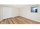 Finished basement bedroom with wood floors and closet at 3702 N Euclid Ave, Indianapolis, IN 46218