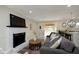 Living room with white fireplace, and view into backyard at 3807 Wyandotte Trl, Indianapolis, IN 46240