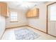 Room with wood cabinets, vinyl floor, and access door at 3920 Oak Harbor Ln, Indianapolis, IN 46237