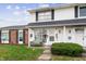 Two-story townhouse with white siding, brick accents, and a small front porch at 4843 Mt Vernon Dr, Indianapolis, IN 46227