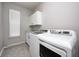 Laundry room with washer, dryer, cabinets, and countertop space at 4936 Myrtle Dr, Pittsboro, IN 46167