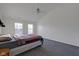 Main bedroom with vaulted ceiling, carpet, and a ceiling fan at 5808 Sedgegrass Xing, Carmel, IN 46033