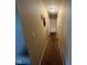 Long hallway with carpeted floors and access to bedrooms at 644 Ash Dr, Carmel, IN 46032