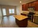 Open concept kitchen with island and stainless steel appliances at 659 Marana Dr, Carmel, IN 46032