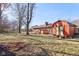 Large backyard featuring a shed and hot tub at 6609 St James Dr, Indianapolis, IN 46217