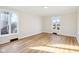 Bright living room with hardwood floors and large windows at 6609 St James Dr, Indianapolis, IN 46217