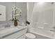 Clean bathroom with white tub, shower, and modern vanity at 713 Penrose Pl, Danville, IN 46122