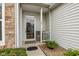 Inviting front porch with a glass door and seating area at 746 Downing Dr, Greenwood, IN 46143