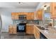 Modern kitchen with light wood cabinets and stainless steel appliances at 746 Downing Dr, Greenwood, IN 46143