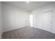 Bedroom with carpet, double doors to closet, and an additional door at 999 Bald Tree Dr, Westfield, IN 46074