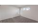 Bright bedroom with gray carpeting and multiple windows at 2110 Round Barn Rd, Anderson, IN 46017