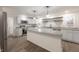 Updated kitchen with white cabinets, granite counters, and an island at 2110 Round Barn Rd, Anderson, IN 46017