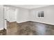 Finished basement room with concrete floors and an open door to hallway at 2829 Macpherson Ave, Indianapolis, IN 46205