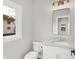 Modern bathroom with white vanity, quartz countertop, and updated light fixture at 2829 Macpherson Ave, Indianapolis, IN 46205