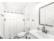 Clean bathroom with white tile, shower, and vanity at 305 Parkway Ave, Indianapolis, IN 46225