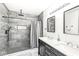 Modern bathroom with double vanity, large shower, and marble tile at 305 Parkway Ave, Indianapolis, IN 46225