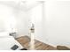Bright bedroom with wood floors and access to another room at 305 Parkway Ave, Indianapolis, IN 46225