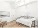 Small bedroom with a daybed, light walls, and hardwood floors at 305 Parkway Ave, Indianapolis, IN 46225
