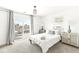 Bedroom with balcony access, window blinds, and neutral decor at 305 Parkway Ave, Indianapolis, IN 46225