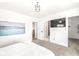 Bright bedroom with ensuite bathroom, large TV, and walk-in closet at 305 Parkway Ave, Indianapolis, IN 46225