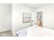 Bedroom with white walls, wood floors, and access to upper hallway at 305 Parkway Ave, Indianapolis, IN 46225