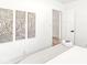 Bedroom with white walls, wood floors, and neutral decor at 305 Parkway Ave, Indianapolis, IN 46225