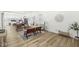 Open concept living area with hardwood floors, neutral decor, and a view into the kitchen at 305 Parkway Ave, Indianapolis, IN 46225