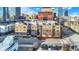 Aerial view of a brick building in a city setting, with downtown skyline in the background at 355 E Ohio E St # 324, Indianapolis, IN 46204