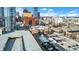 Aerial view of a brick building in a city setting, with downtown skyline in the background at 355 E Ohio E St # 324, Indianapolis, IN 46204