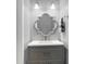 Small bathroom with gray vanity and unique mirror at 355 E Ohio E St # 324, Indianapolis, IN 46204