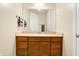 Bathroom with wood vanity, single sink, and mirror at 355 E Ohio E St # 324, Indianapolis, IN 46204
