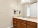 Clean bathroom with wood vanity and a large mirror at 355 E Ohio E St # 324, Indianapolis, IN 46204