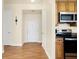 Light and bright entryway with hardwood floors and kitchen appliances at 355 E Ohio E St # 324, Indianapolis, IN 46204