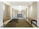 Hallway with contemporary carpet, benches, and natural light at 355 E Ohio E St # 324, Indianapolis, IN 46204